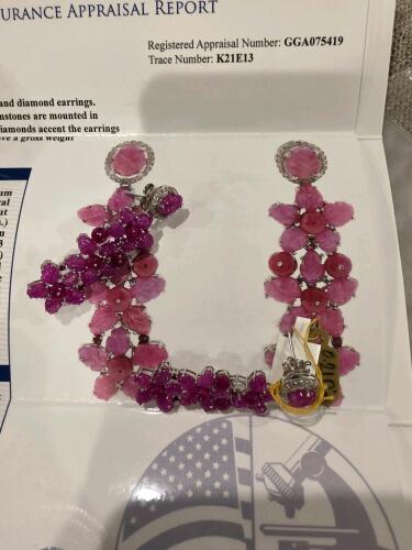 sterling silver Ruby and diamond earrings one needs a repair