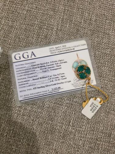emerald and diamond sterling silver pendant