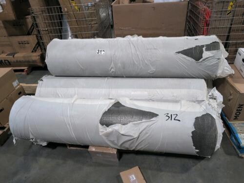 Four large rolls of flooring material
