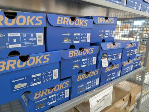 12 pairs of brooks shoes