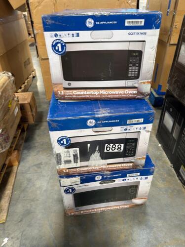 Three GE countertop microwaves