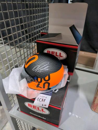 five mini McLaren racing helmets signed