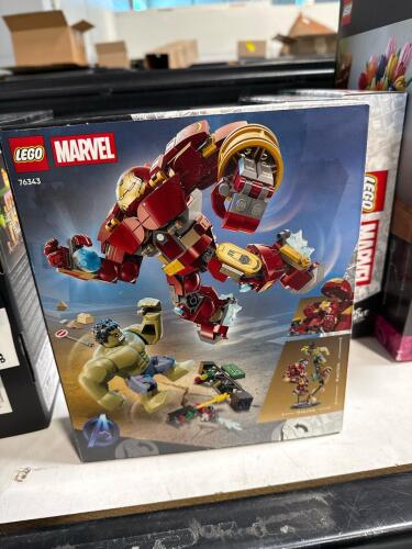 three Lego marvel epic battle hulkbuster vs the hulk, and two tulip bouquet units