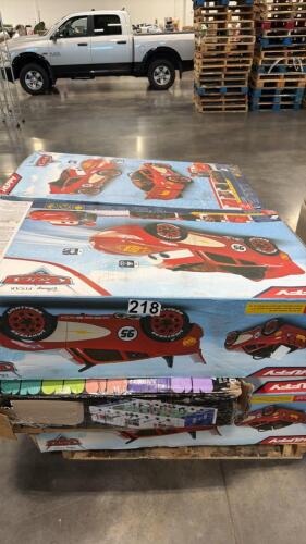 Multiple lightning McQueen ride on cars and foosball table may have damage