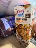 Big box store a box, ROTEL, dental treats for dogs, great, barbecue sauce, cups, Chex mix unit butter chocolate bars, dog food, crackers, pre-lit 6 foot oversize spider, ALL, & More - 2
