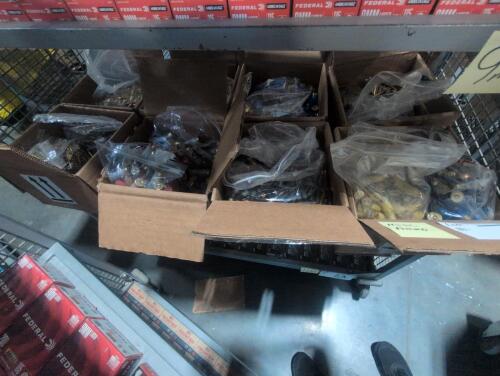 shelf of boxes full of miscellaneous ammo