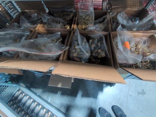 shelf of boxes full of miscellaneous ammo