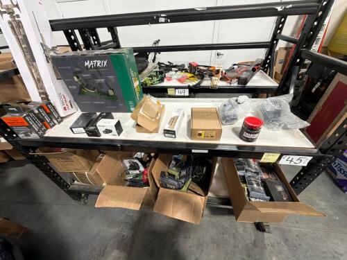 two shelves full of gun accessories