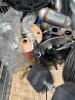 Industrial and automotive items, small tire, cabling, muffler, brake rotor, large 40 lb dumbbell, and more - 4