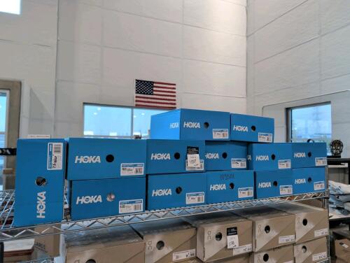 13 pairs of Hoka shoes