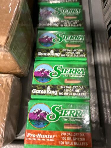 shelf of reloading, brass, canisters, and more