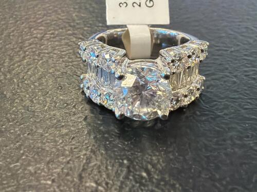Platinum baguette round brilliant cut diamond ring with 5.31 total carats of diamonds