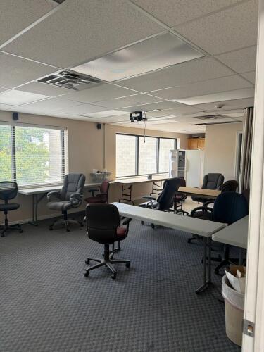 Two rooms with contents including but not limited to computers, office chairs, tables, fridge, miscellaneous appliances, HP projector, speakers, desks, phones, & More
