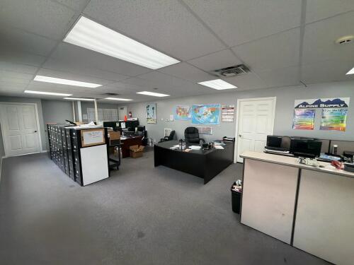Main office room with contents including unlimited to tasks, computer, multiple printers, filing cabinet cabinets, LEXMARK XM 7163 printer, Shredder, Epson printer, multiple filing cabinets, utility cart, & More