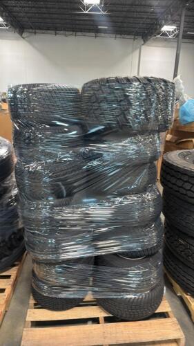 Approximately 28 small tires with rims