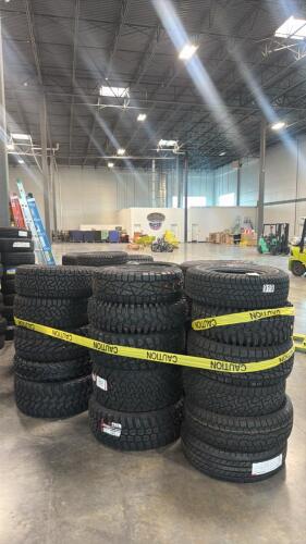 Approximately 65 larger truck off-road tire tires