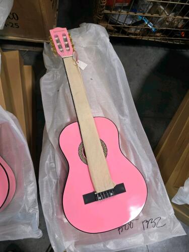 five pink Carl Schneider acoustic guitars