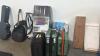 Luggage, box of Beatrice ball bowls, gladiator gear rack golf, hot wheels track, Zumiez skateboard, pool stick, golf bag, Johnson guitar, guitar case - 2