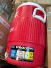 Igloo cooler, books, BATTING, Furniture pieces, standing desk piece, toilet paper, and