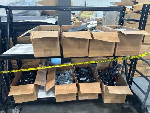 Electronics: charging cables, sound mixer, headphones, multiple controllers, most items appear used