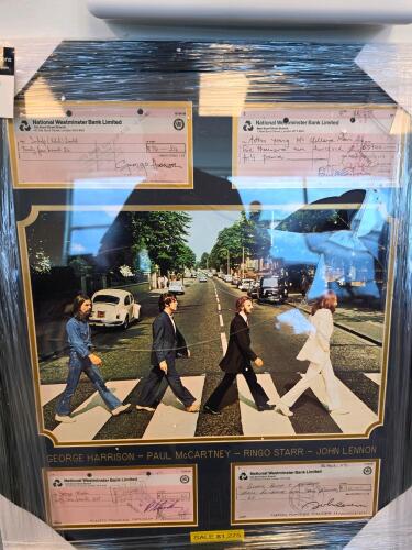 The Beatles framed collectible with damage to glass