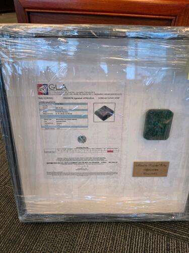 nearly 1200 carat emerald framed with appraisal