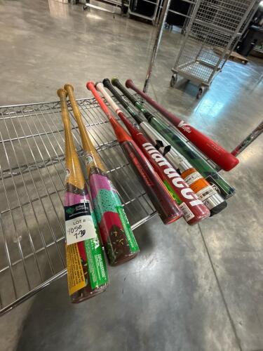 large lot of baseball and softball bats