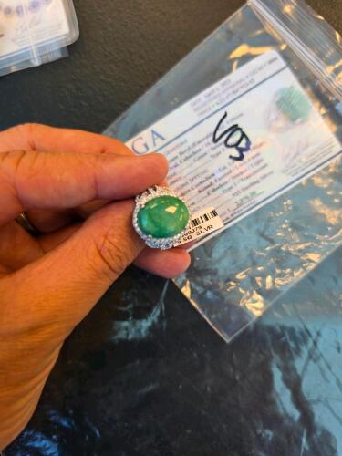 tight green emerald and sapphire ring