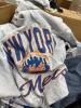 clothing, some mountain hardwear women's t-shirts, jackets, activewear, Wrangler denim, some licensed baseball clothing and sweatshirts, a few pairs of shoes, boots, New balance, some Peter Millar and much more - 12