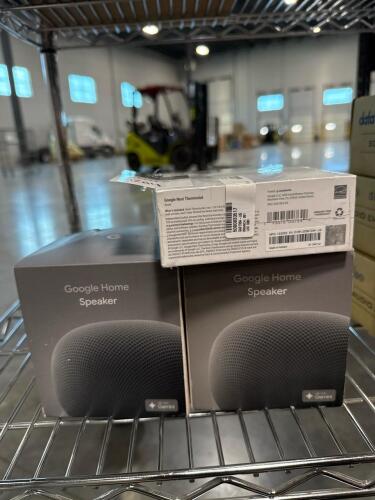 Two Google Home speakers and nest thermostat