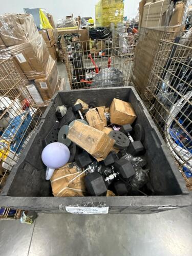 bin of weights, dumbbells, plate weights, and more