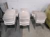 Approximately 37 stacking chairs, used