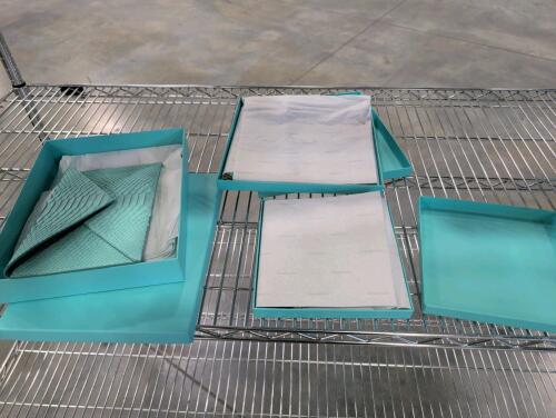 Tiffany & Co. silk pockets, turquoise Tiffany & Co. envelope clutch features an embossed faux-snakeskin texture and perfume